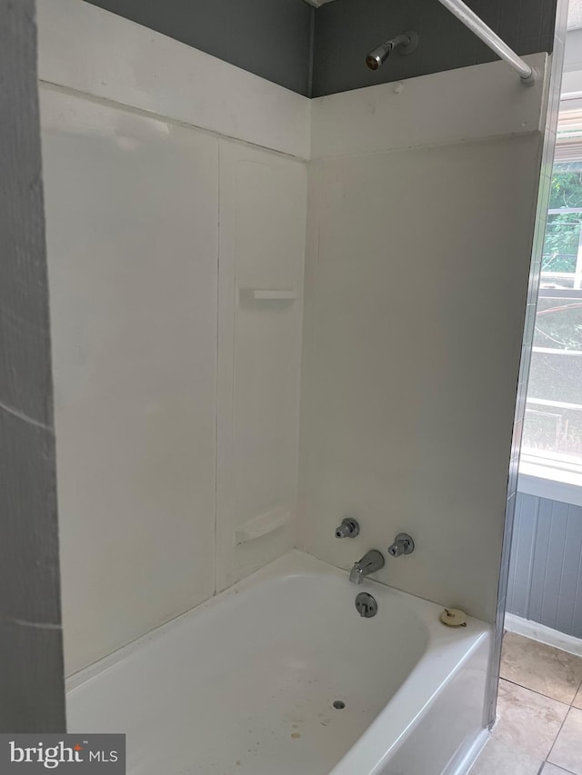 bathroom featuring shower / bathtub combination, tile floors, and a wealth of natural light