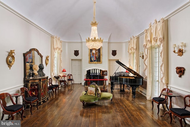 sitting room with a notable chandelier, high vaulted ceiling, and dark hardwood / wood-style floors