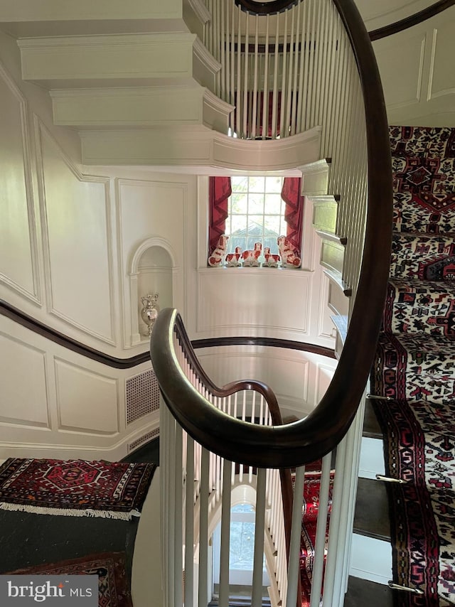 stairway featuring a high ceiling