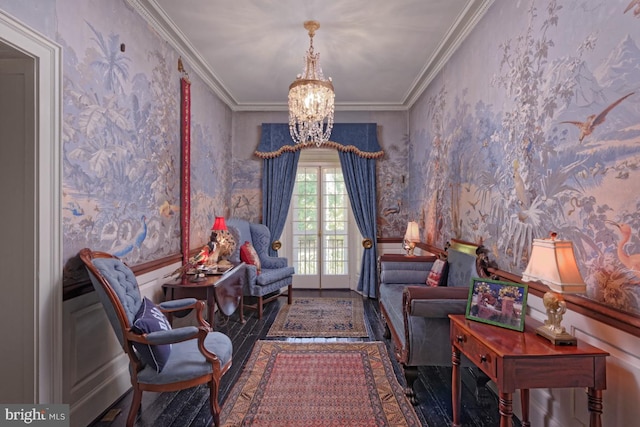 living room featuring an inviting chandelier, crown molding, and dark hardwood / wood-style floors