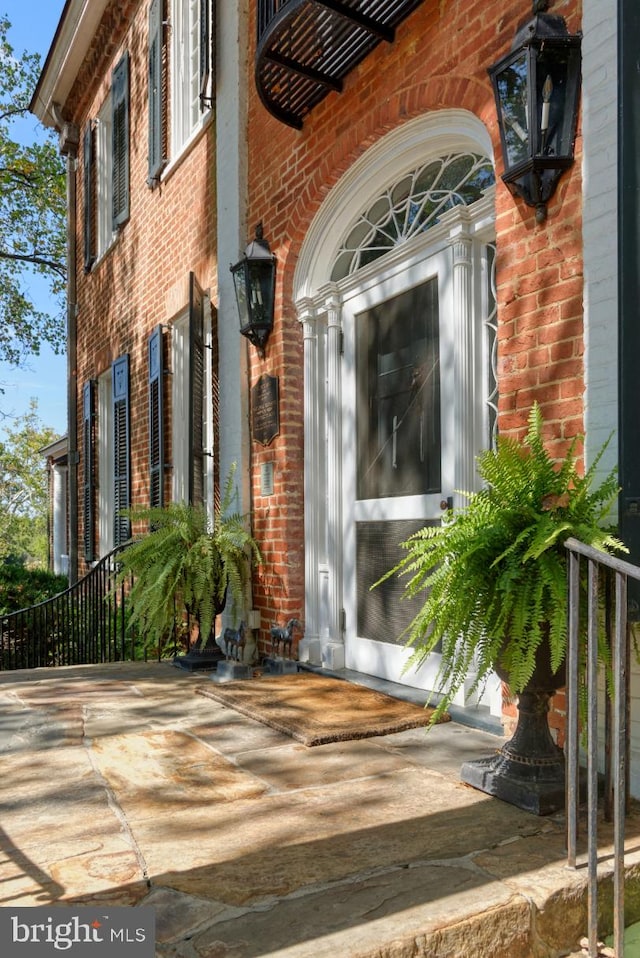 entrance to property with a patio