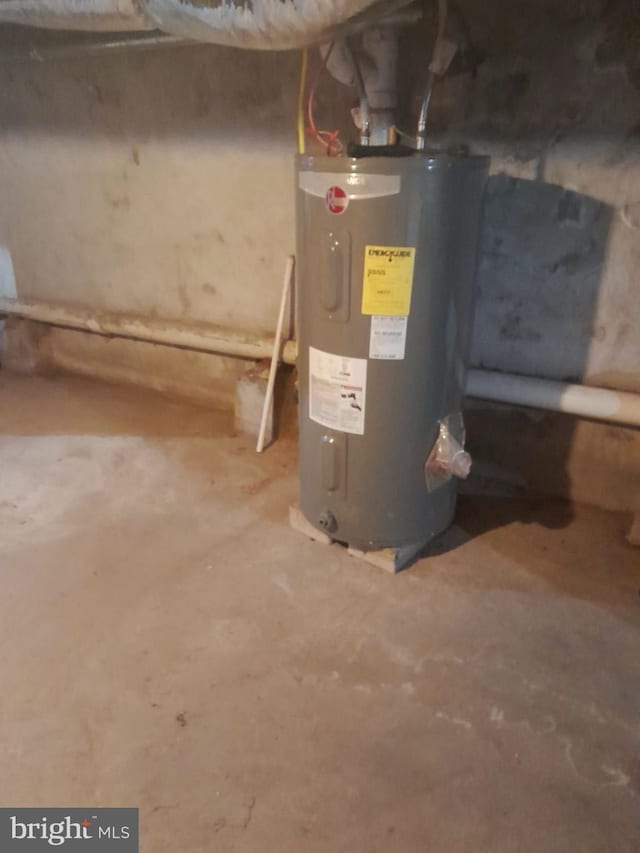 utility room with electric water heater