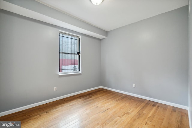 unfurnished room with light hardwood / wood-style flooring