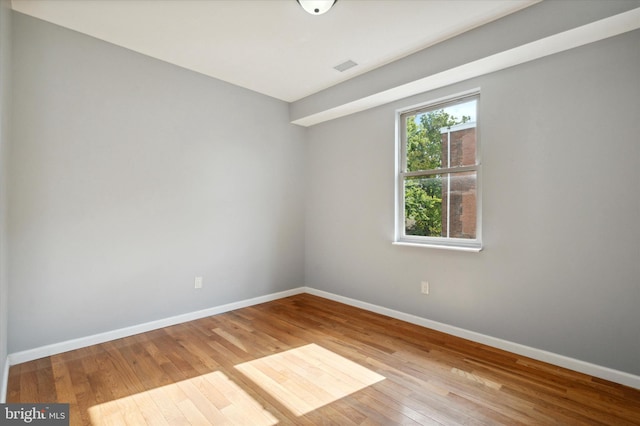 spare room with light hardwood / wood-style floors