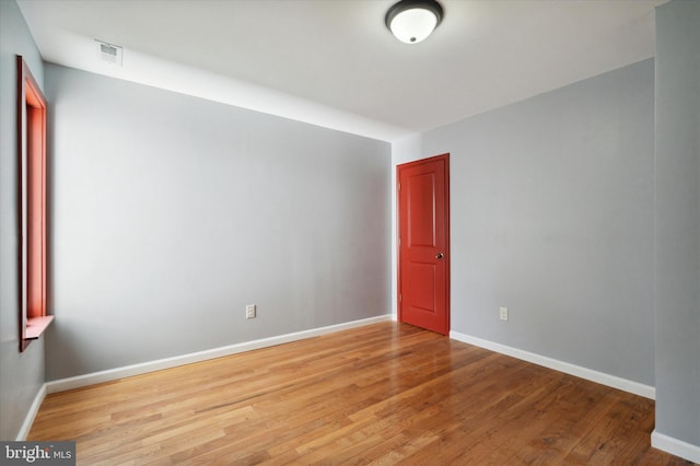 empty room with light hardwood / wood-style floors