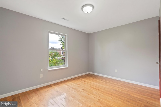 unfurnished room featuring light wood-type flooring