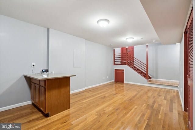 basement featuring light hardwood / wood-style flooring