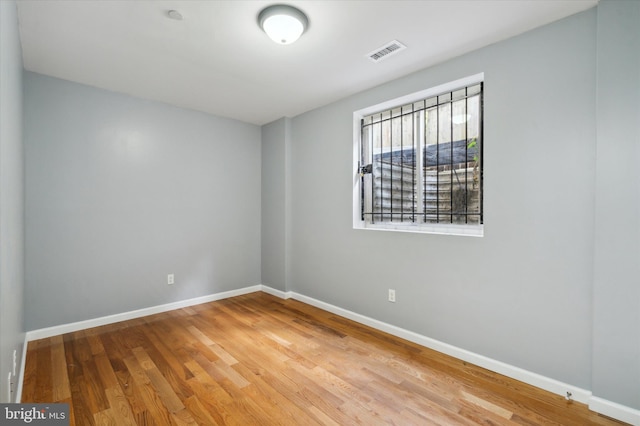 spare room with light wood-type flooring