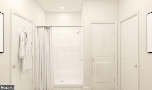 bathroom with a shower with shower curtain