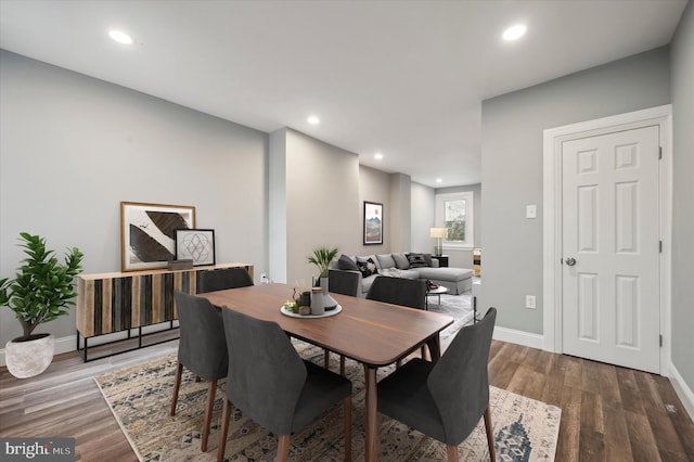 dining area with hardwood / wood-style floors