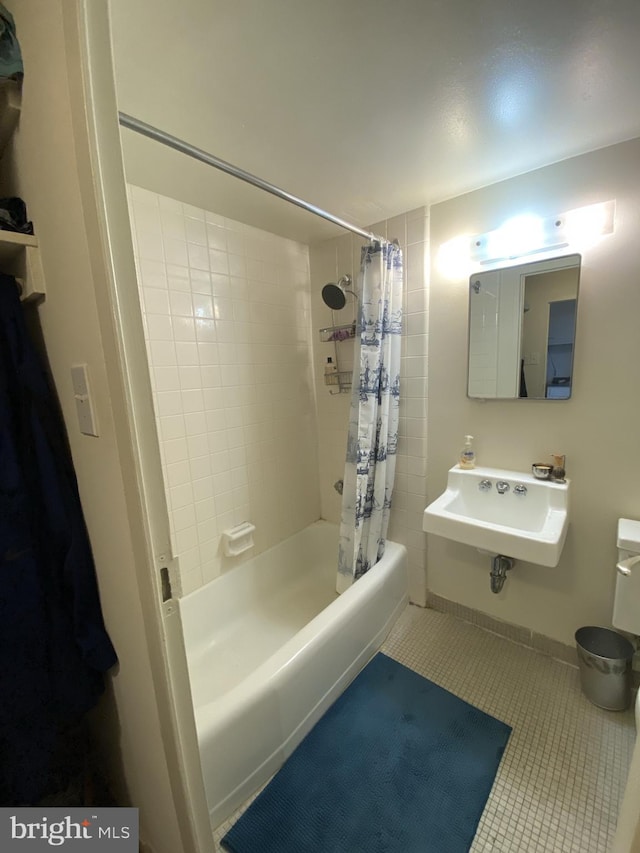 bathroom with sink, tile patterned floors, and shower / tub combo