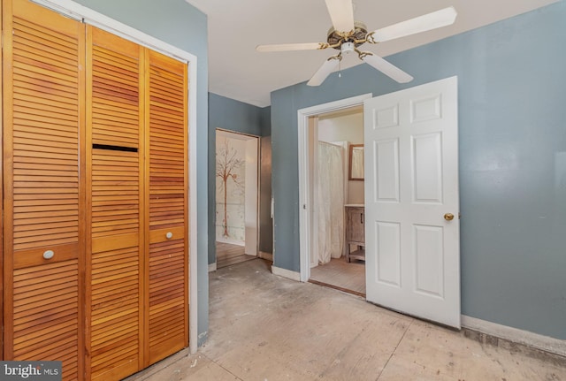 unfurnished bedroom featuring ensuite bathroom, a closet, and ceiling fan