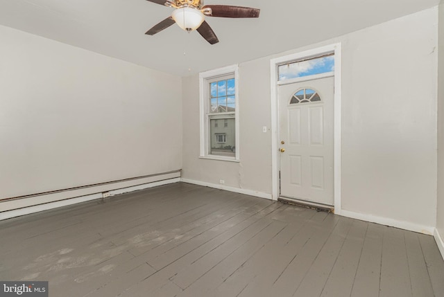 entryway featuring a baseboard radiator, ceiling fan, and dark wood-type flooring