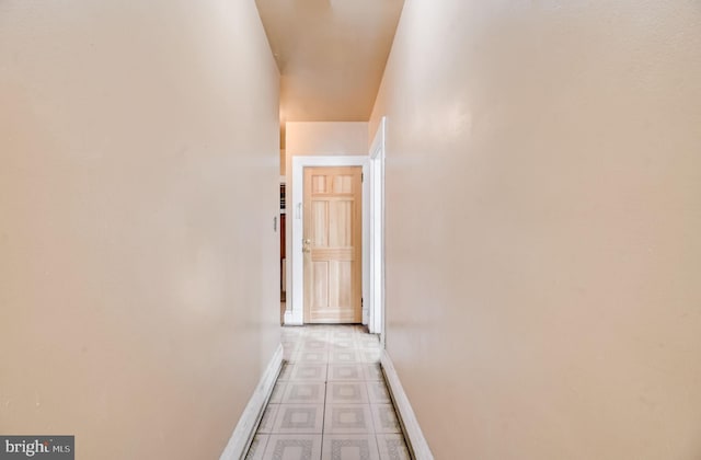 corridor with light tile floors