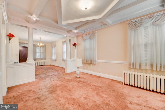 interior space featuring a notable chandelier, beam ceiling, radiator heating unit, and coffered ceiling