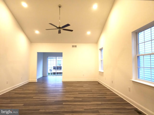 unfurnished room with ceiling fan, dark hardwood / wood-style flooring, and high vaulted ceiling