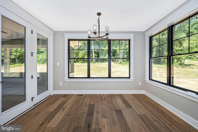 unfurnished sunroom with a chandelier