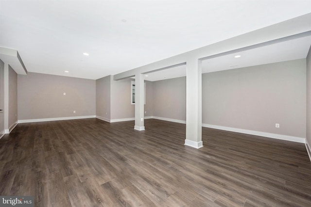 basement featuring dark hardwood / wood-style floors