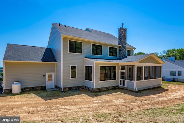 back of house featuring a sunroom