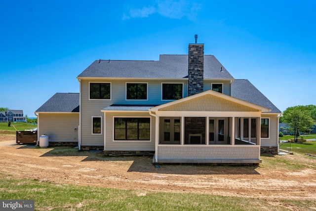 back of property featuring a sunroom