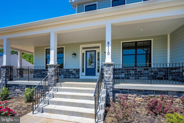 property entrance featuring a porch