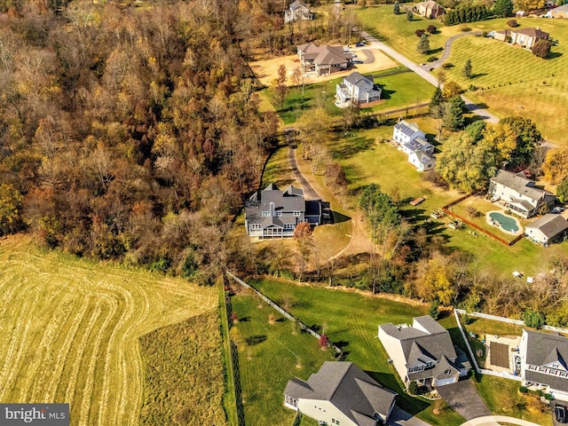 birds eye view of property with a rural view