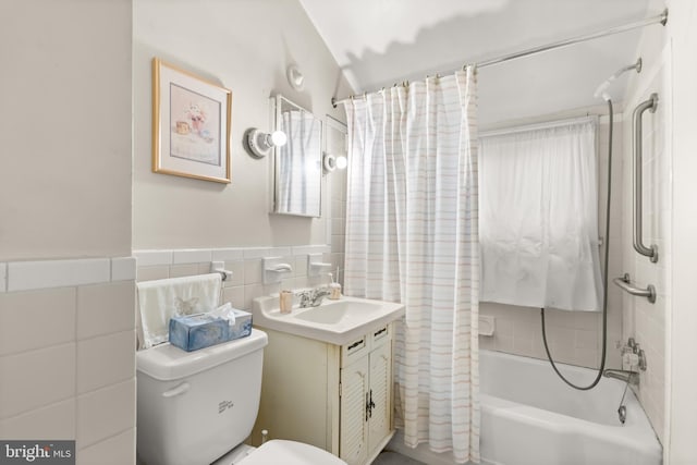 full bathroom featuring vanity, tile walls, toilet, and shower / tub combo with curtain