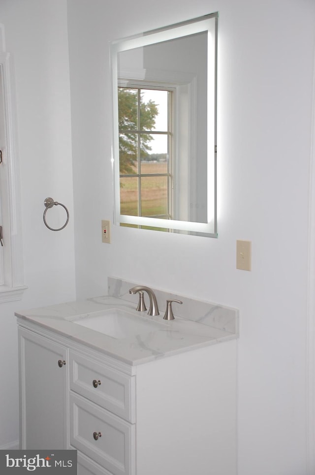 bathroom with vanity with extensive cabinet space