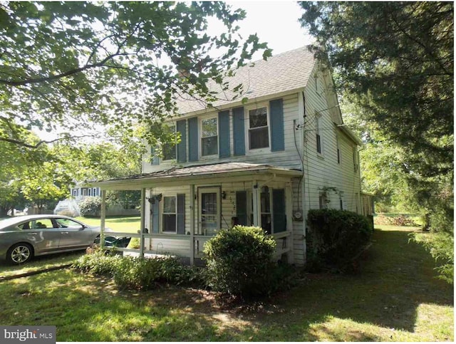 view of front of home with a front lawn and a porch