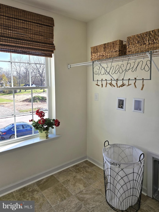 interior space featuring dark tile floors and a healthy amount of sunlight