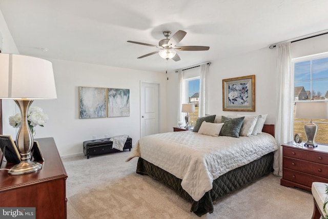 carpeted bedroom featuring ceiling fan