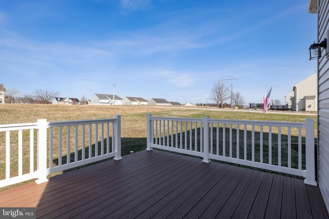 wooden deck with a lawn