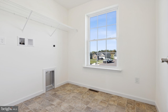 laundry room with hookup for an electric dryer, washer hookup, and light tile floors