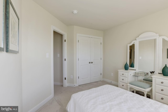 carpeted bedroom with a closet