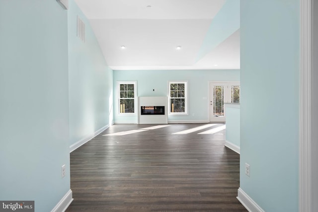 unfurnished living room featuring dark hardwood / wood-style flooring