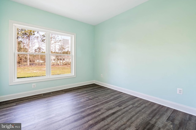 unfurnished room featuring dark hardwood / wood-style flooring