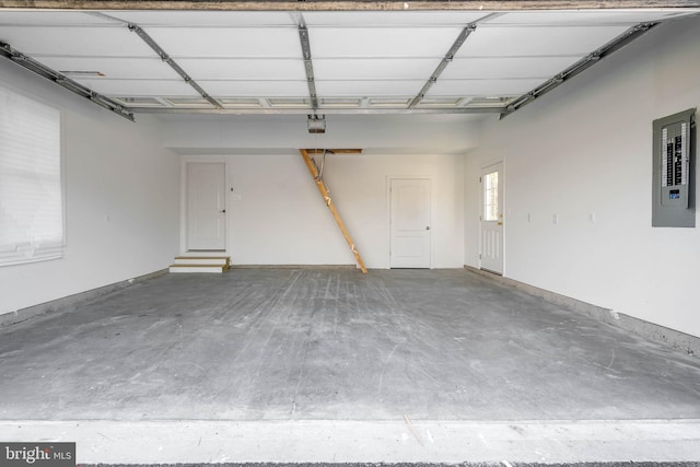 garage featuring a garage door opener and electric panel