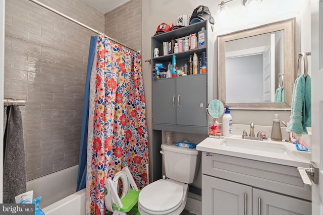 full bathroom with shower / tub combo, vanity, and toilet