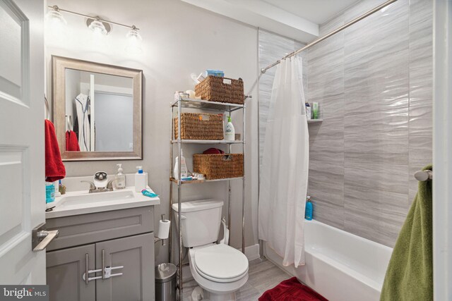 full bathroom with toilet, vanity, and shower / bathtub combination with curtain