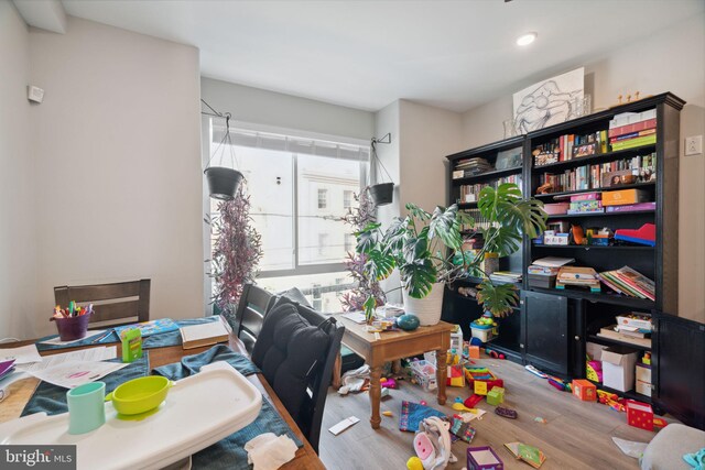 home office with light hardwood / wood-style floors