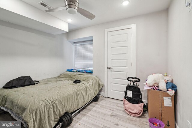 bedroom featuring light hardwood / wood-style flooring and ceiling fan