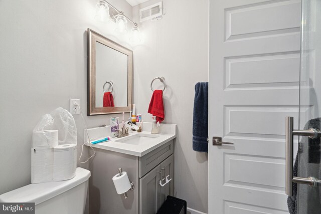 bathroom with toilet and vanity