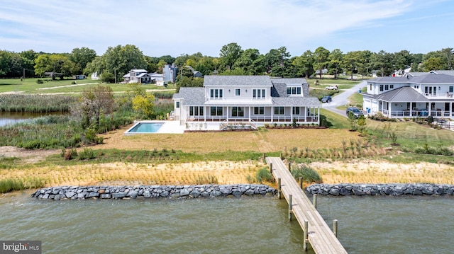 rear view of house with a water view