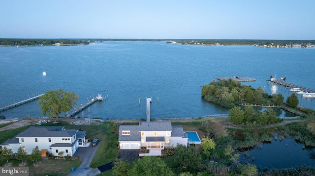 birds eye view of property featuring a water view