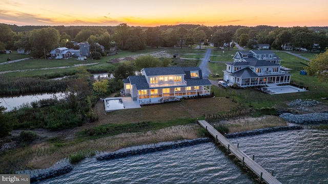 aerial view at dusk with a water view