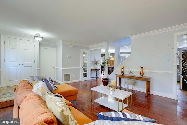 living room featuring dark hardwood / wood-style flooring and ornamental molding