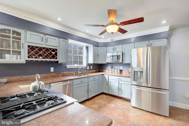 kitchen featuring gray cabinets, ceiling fan, appliances with stainless steel finishes, and sink