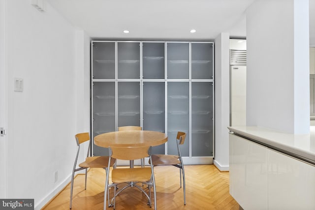 dining room featuring light parquet floors