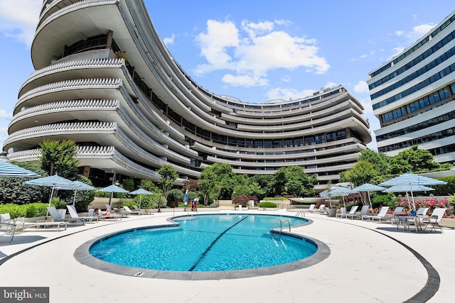 view of swimming pool featuring a patio area