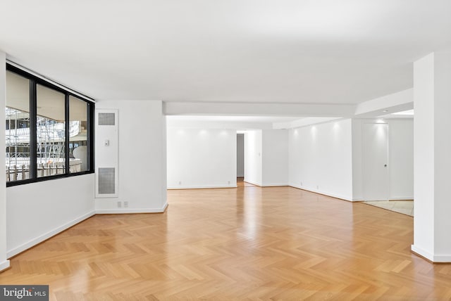 spare room featuring light parquet floors